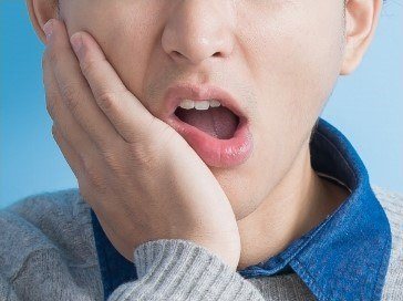 boy with tooth pain